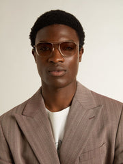 Aviator-style sunglasses with gold frame and beige lenses