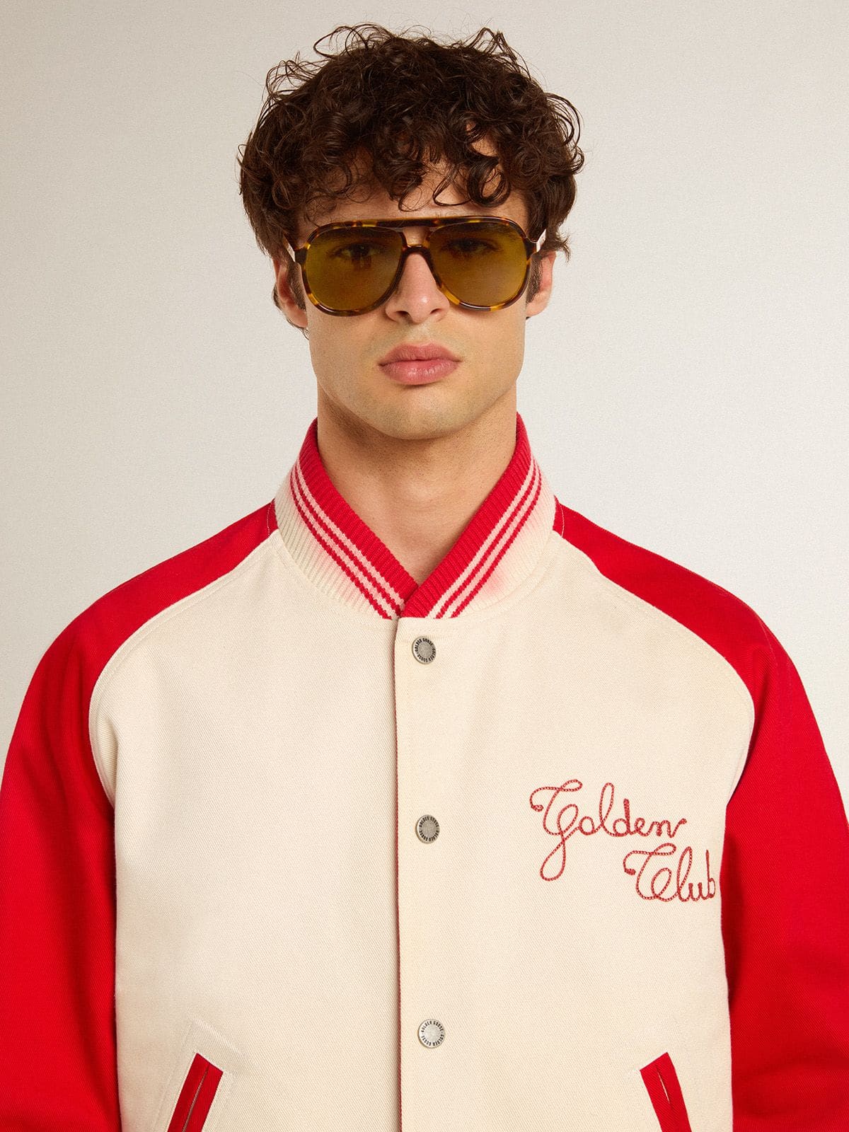 Aviator style sunglasses with tortoiseshell frame and green lenses