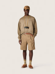 Square style Panthos sunglasses with havana brown frame and green lenses