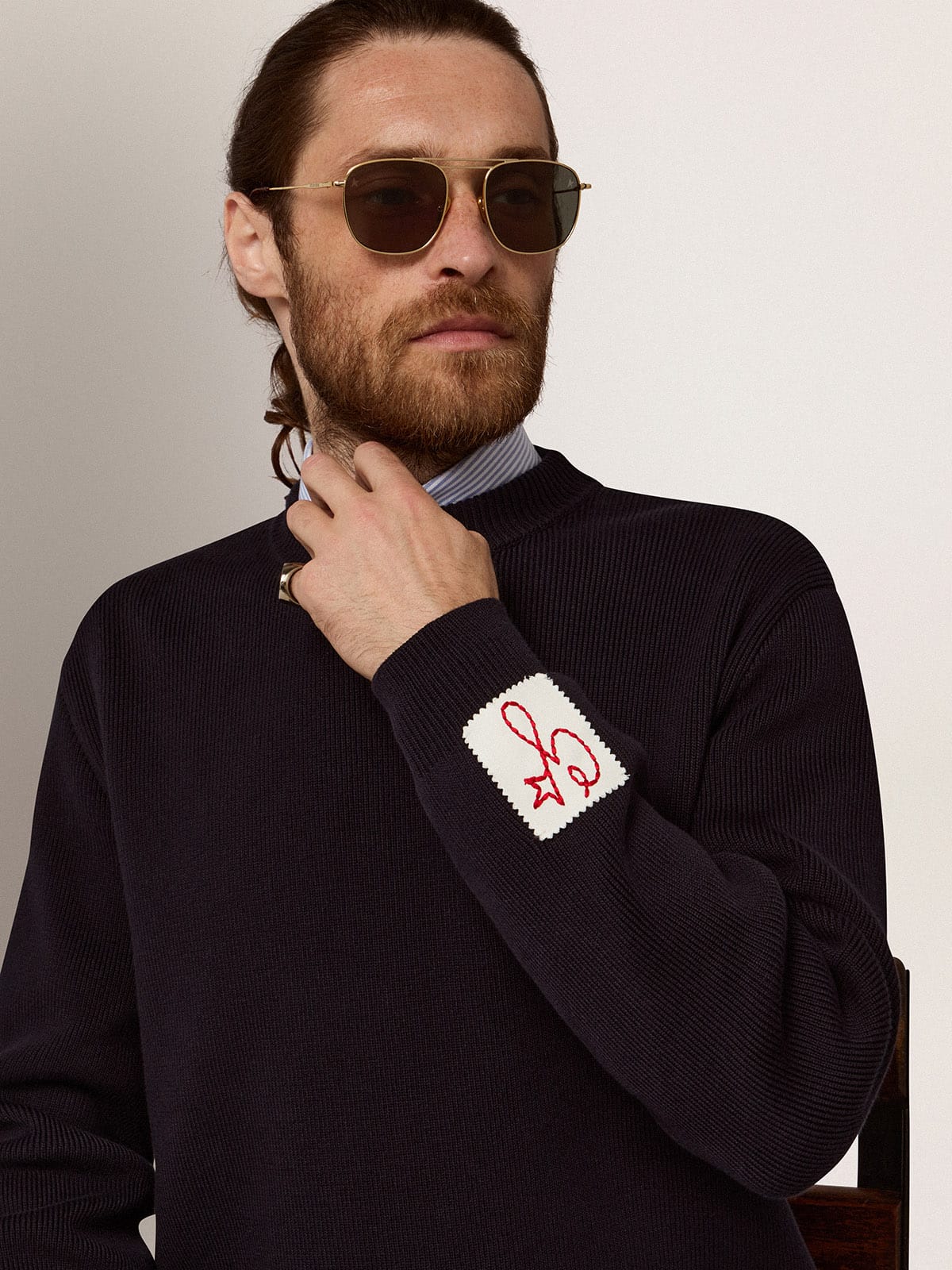 Aviator sunglasses with gold frame and green lenses