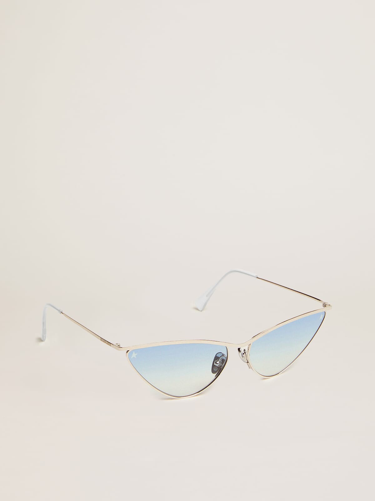 Sunglasses cat-eye style with silver frame and blue lenses