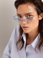 Sunglasses cat-eye style with silver frame and blue lenses