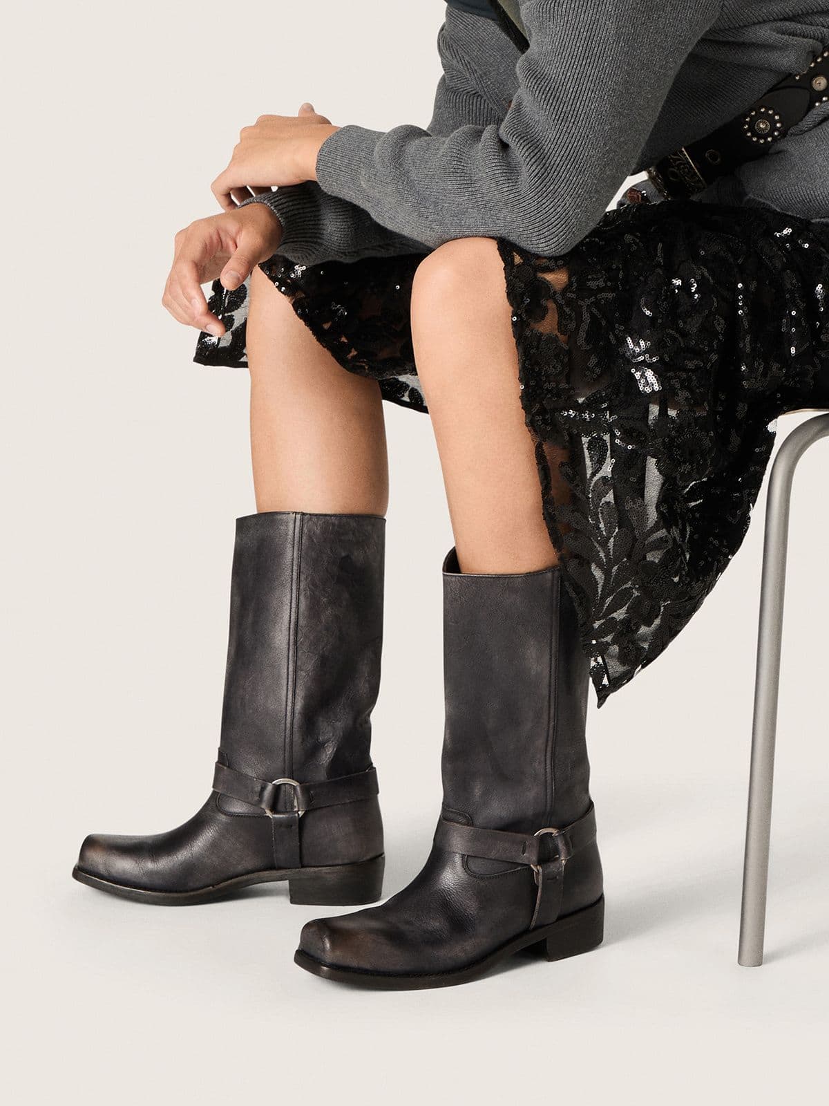 Women's high Biker boots in black leather with strap and silver-colored buckle