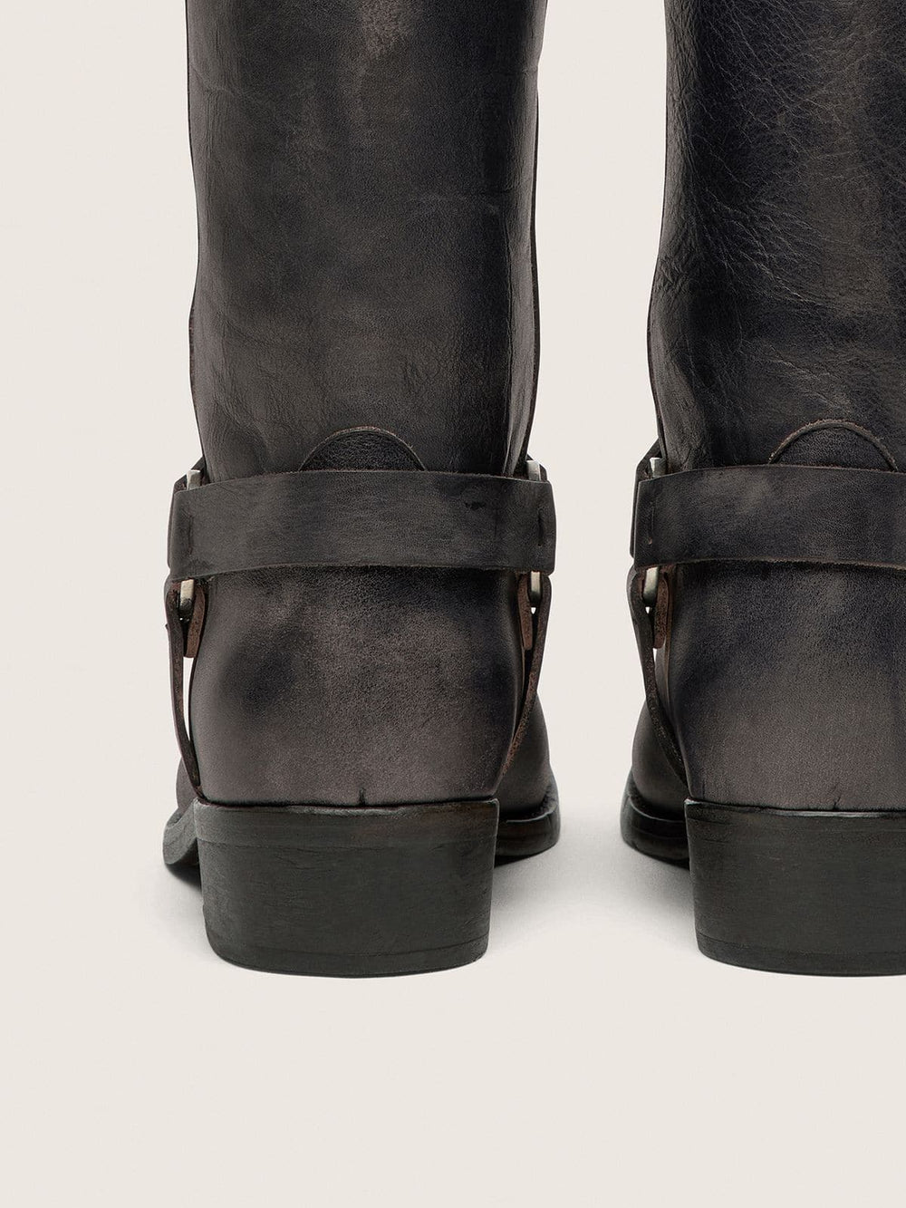 Women's high Biker boots in black leather with strap and silver-colored buckle