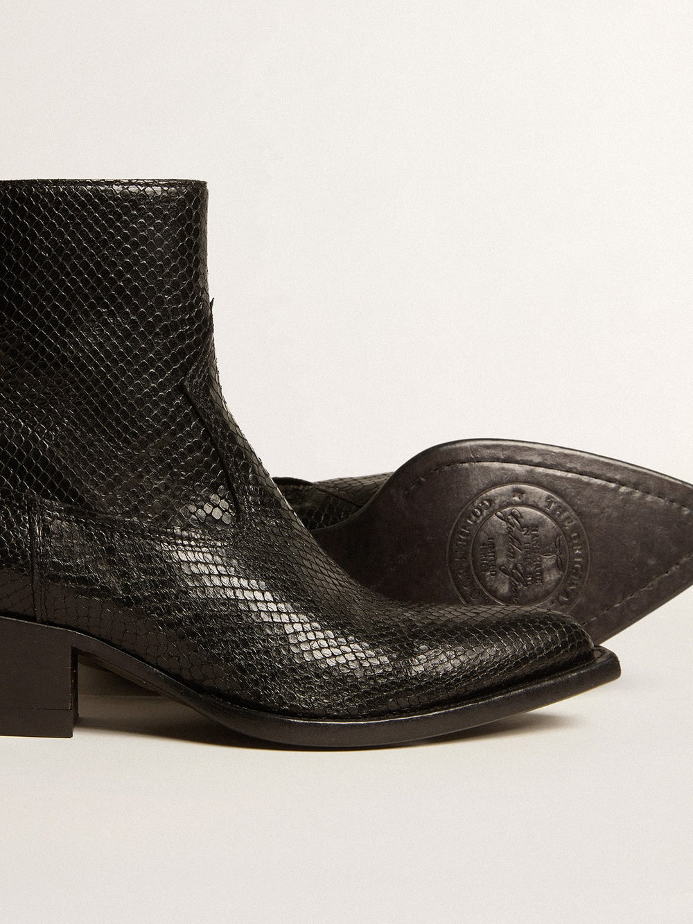 Low Debbie boots in black snake-print leather