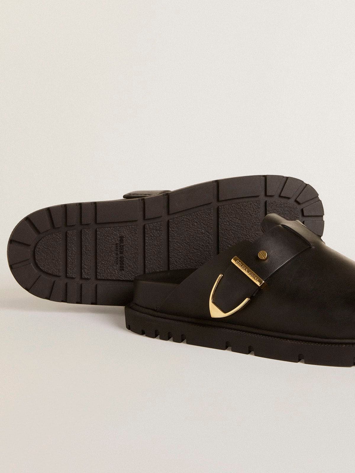 Women's Lucy Sabot in glossy black leather with gold metal buckle