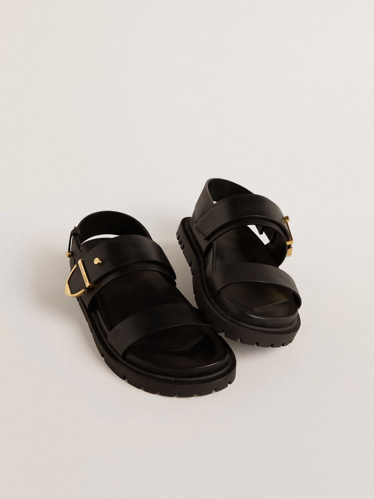 Women's Lucy sandal in glossy black leather with gold metal buckle