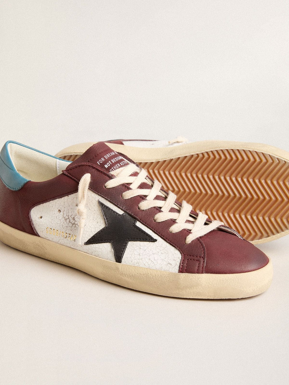 Men’s Super-Star in crackle leather with brown star and teal heel tab