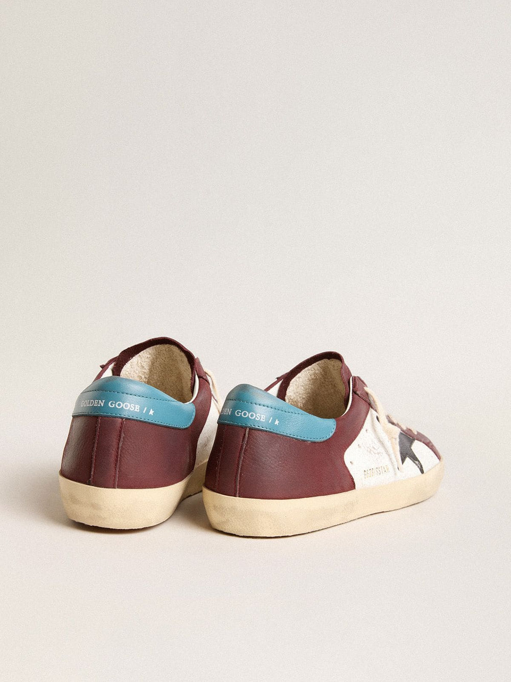 Men’s Super-Star in crackle leather with brown star and teal heel tab