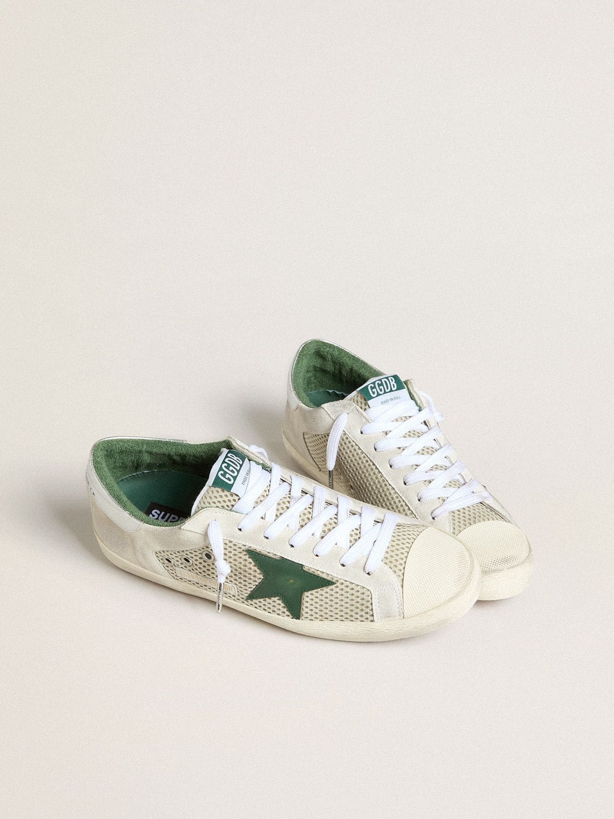 Men’s Super-Star LTD in white suede and mesh with green leather star and silver heel tab