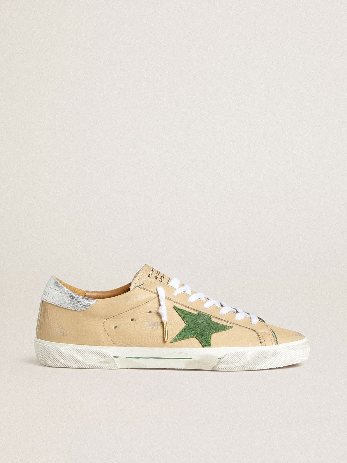 Super-Star LTD in beige leather with green suede star and silver foiled leather heel tab