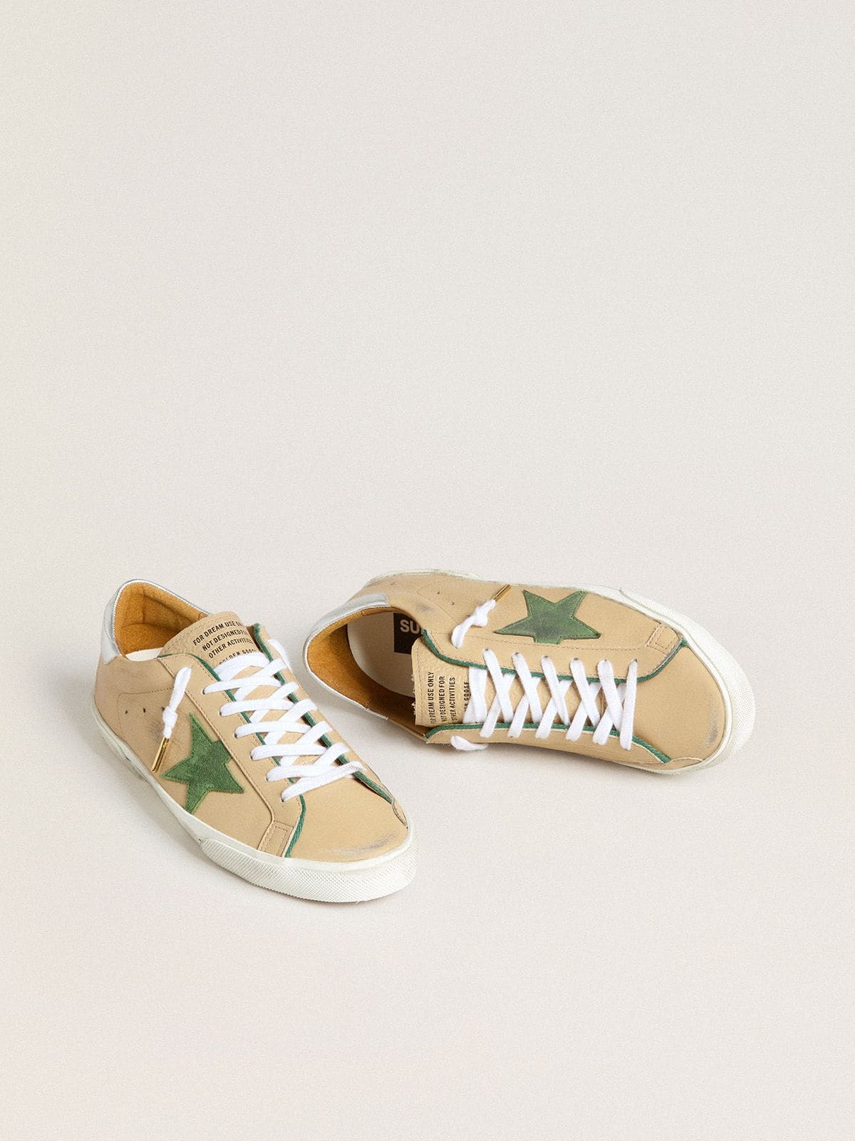 Super-Star LTD in beige leather with green suede star and silver foiled leather heel tab