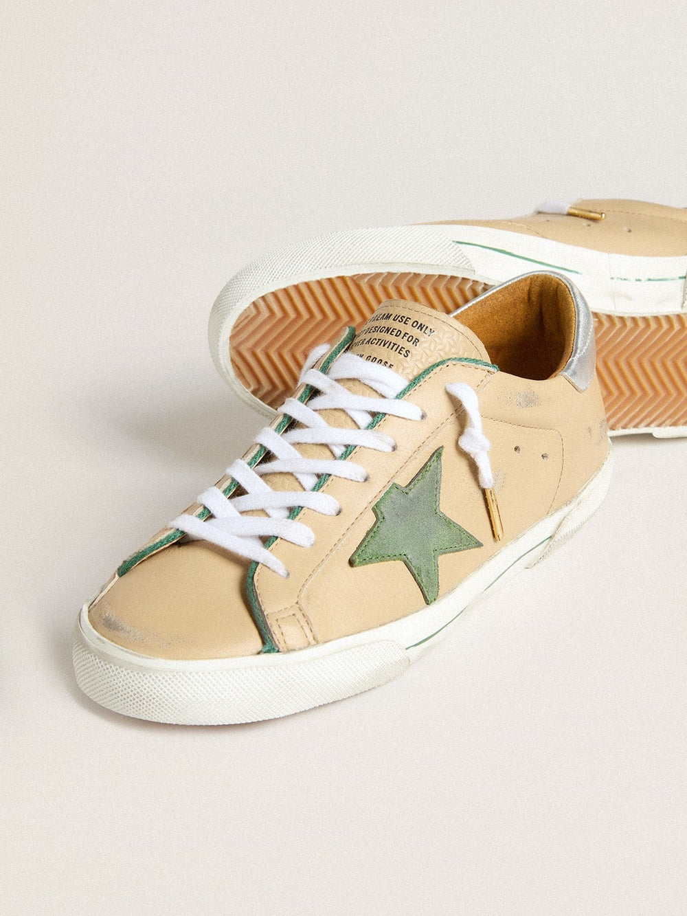Super-Star LTD in beige leather with green suede star and silver foiled leather heel tab