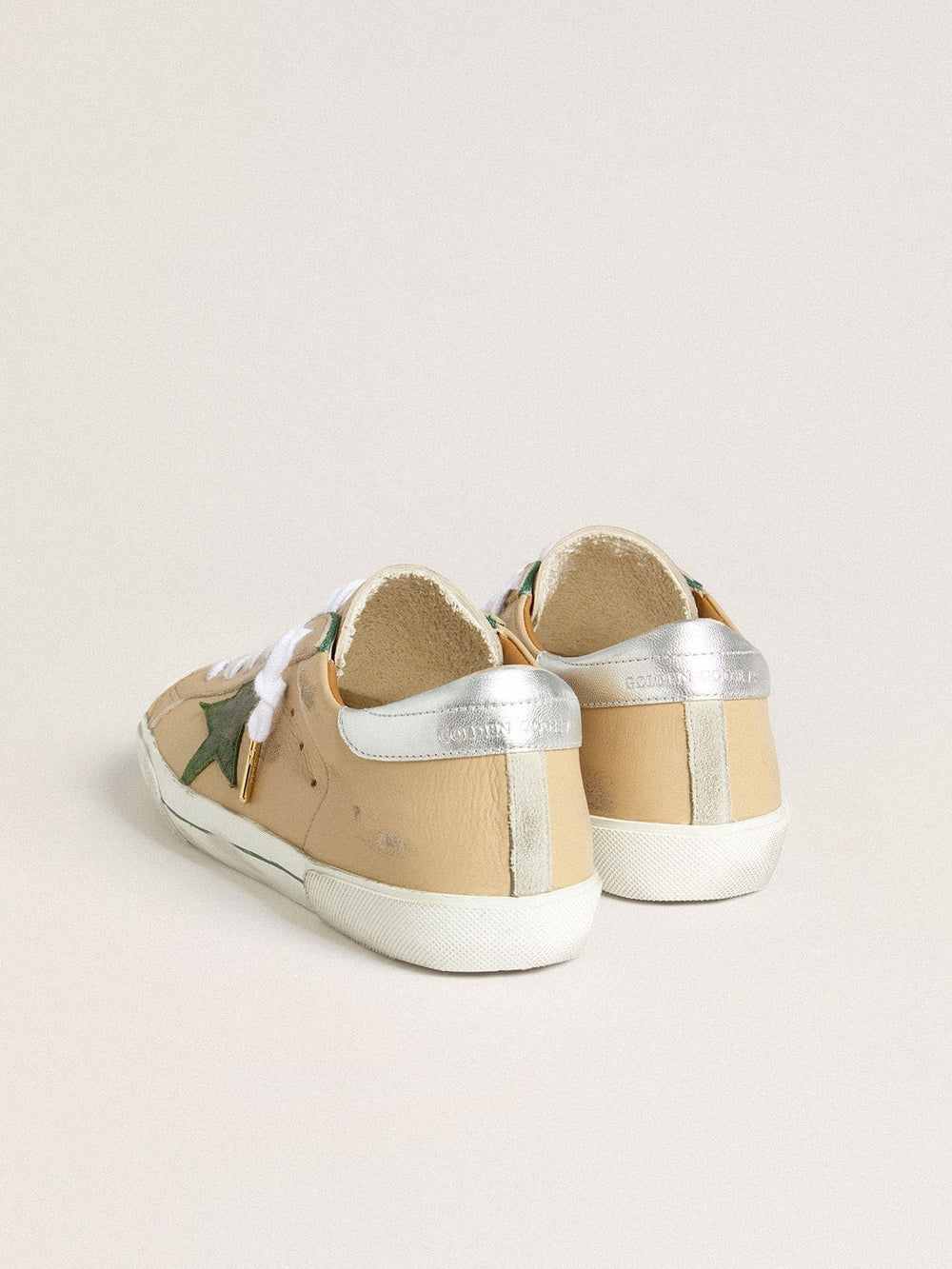 Super-Star LTD in beige leather with green suede star and silver foiled leather heel tab