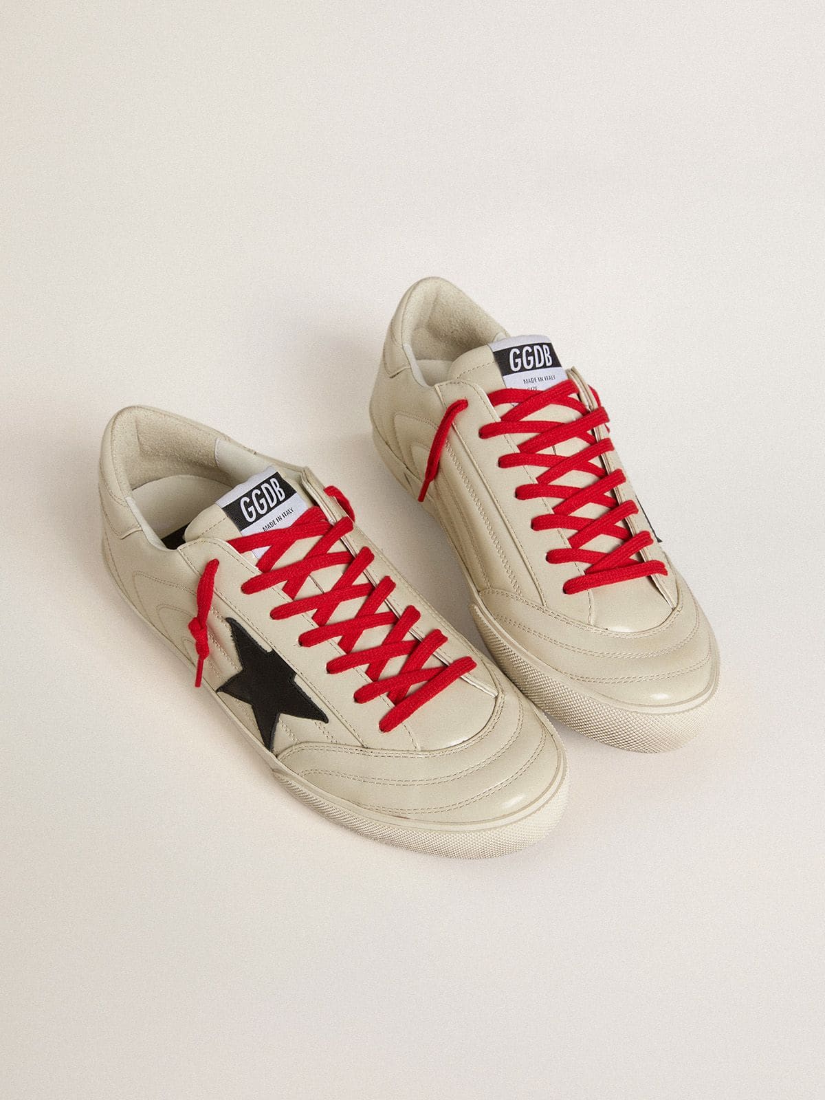 Men's Super-Star in glossy white matelassé leather with black leather star