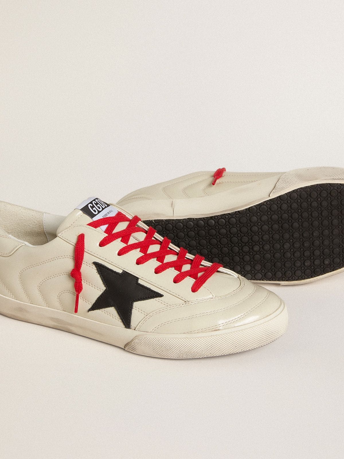 Men's Super-Star in glossy white matelassé leather with black leather star