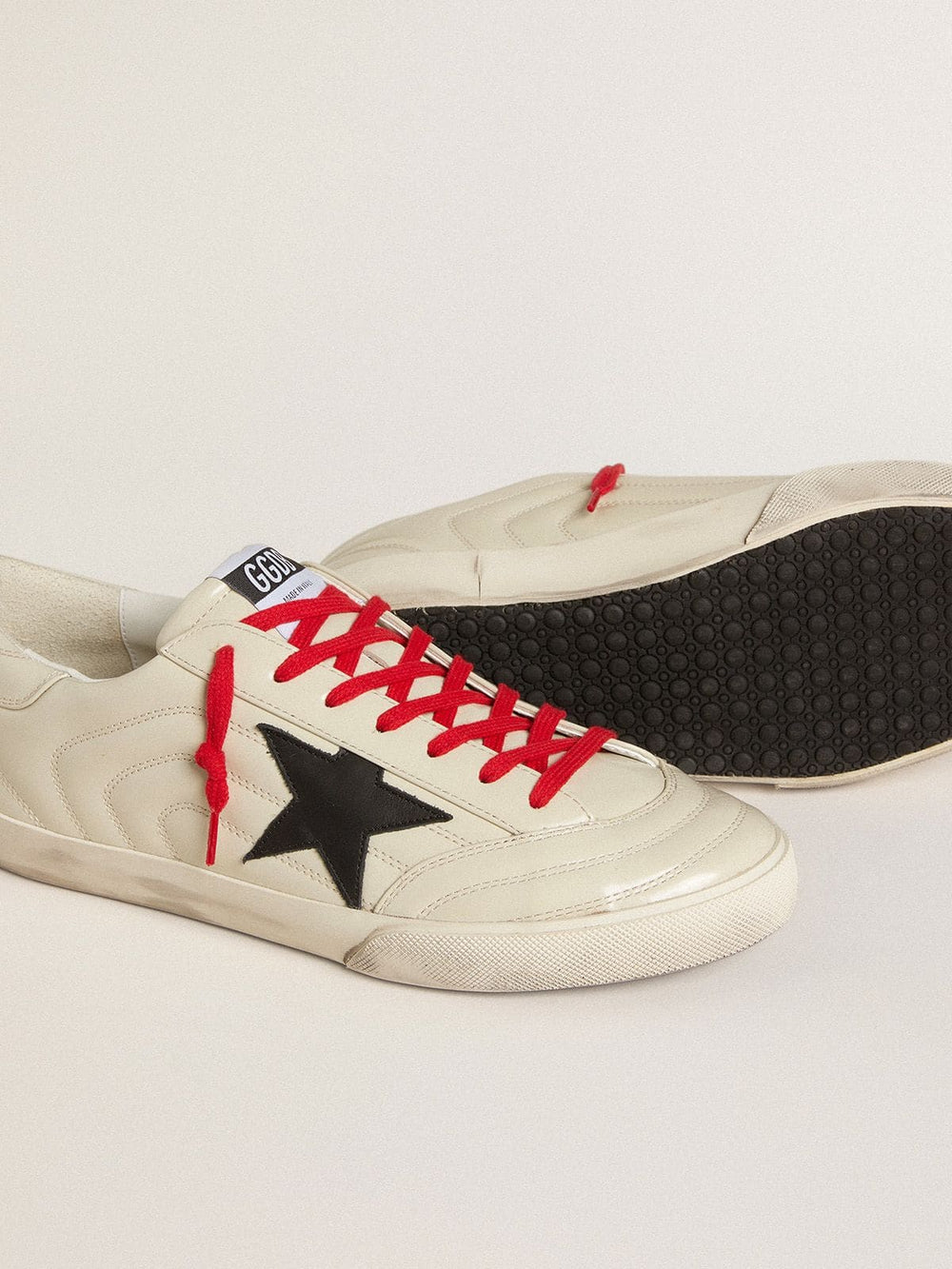 Men's Super-Star in glossy white matelassé leather with black leather star