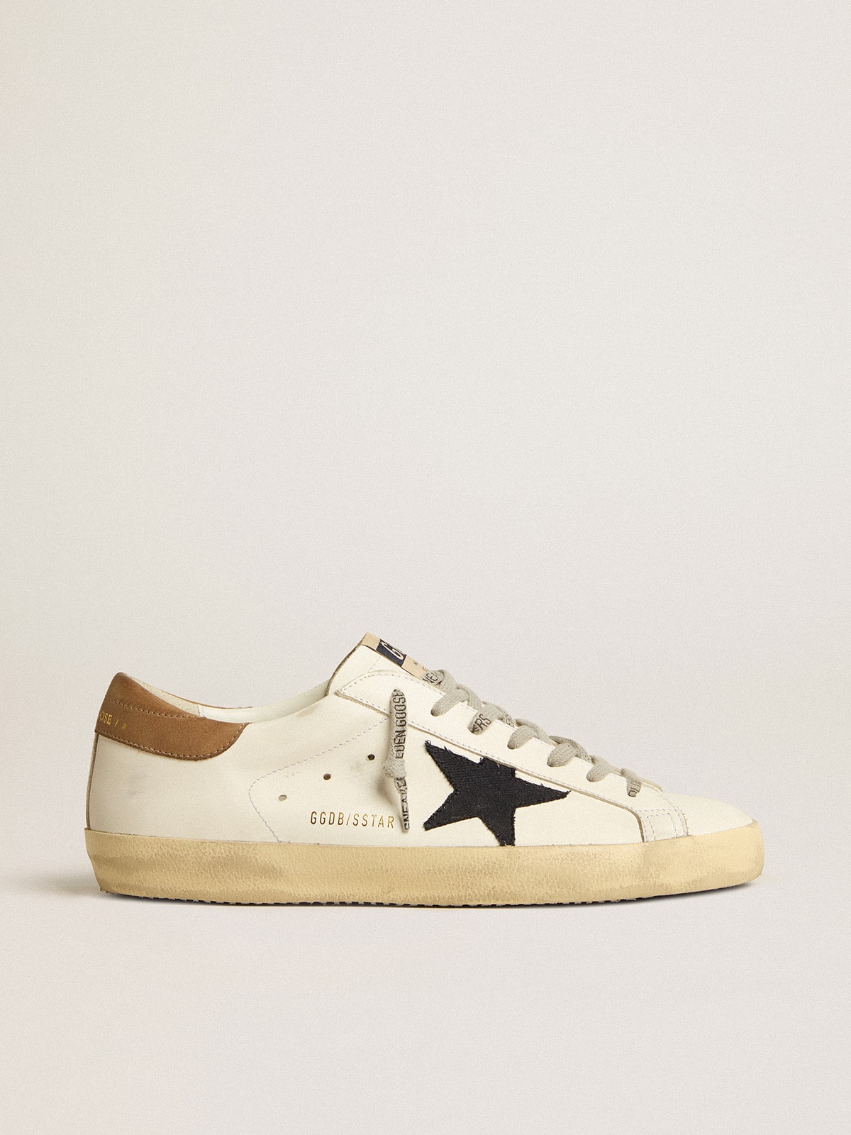 Men's Super-Star in white leather with midnight-blue canvas star and tobacco leather heel tab