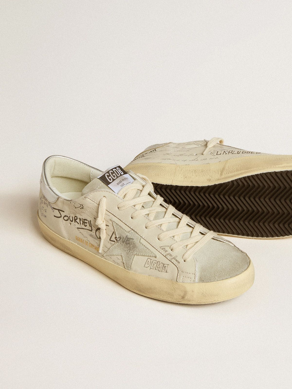 Men's Super-Star in white leather with all-over lettering and ice-gray suede star