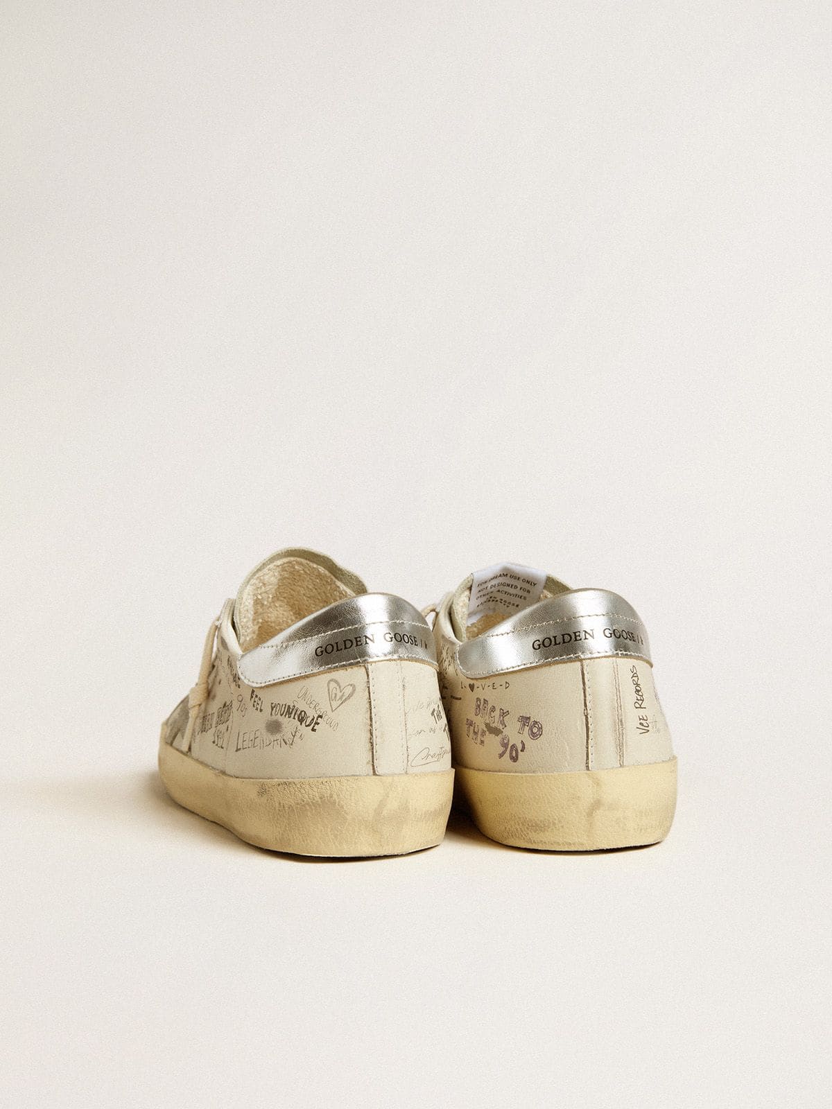 Men's Super-Star in white leather with all-over lettering and ice-gray suede star