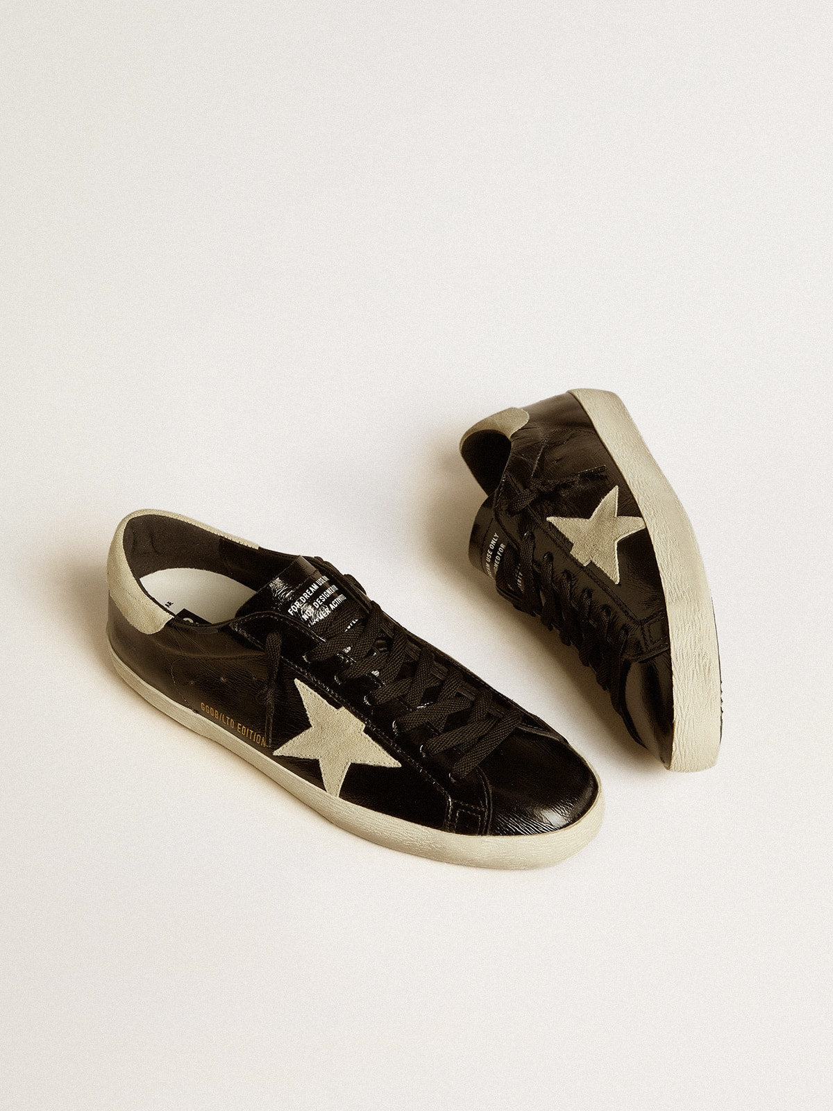 Men's Super-Star in black patent leather with suede star and heel tab