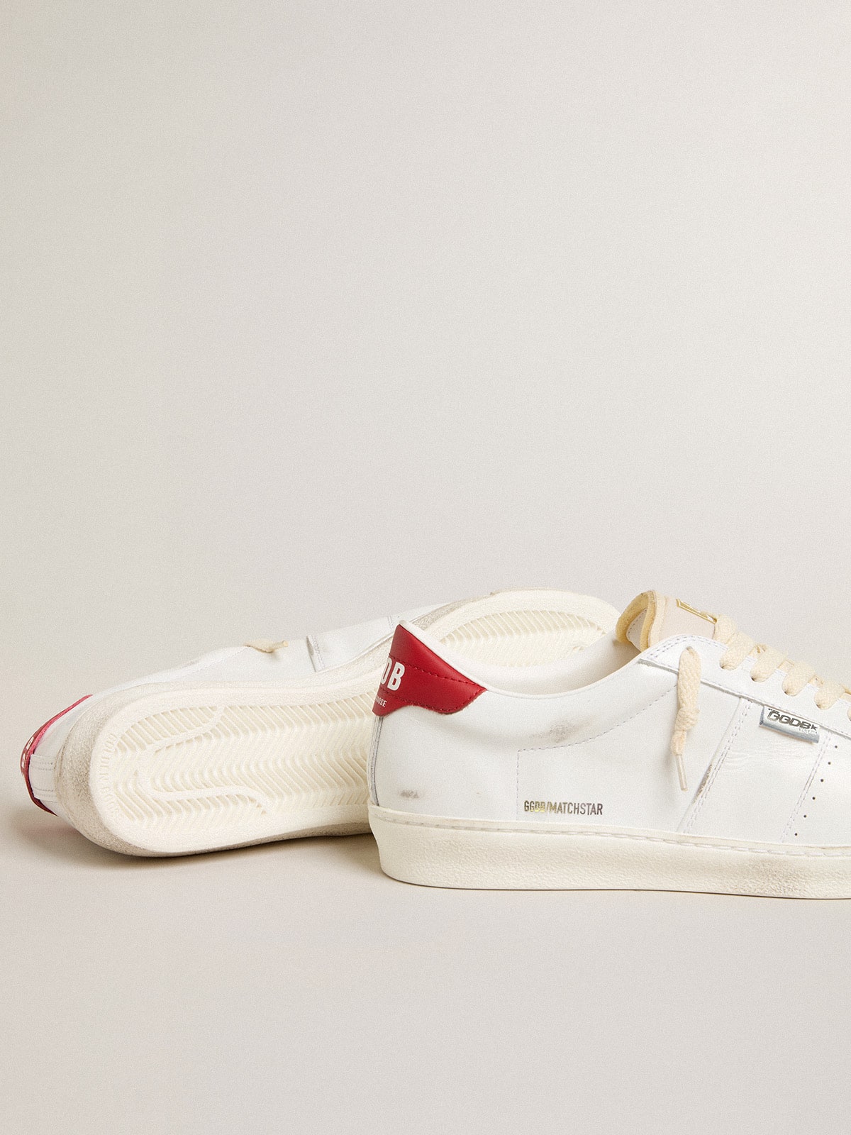 Matchstar in glossy white leather with glossy red leather heel tab