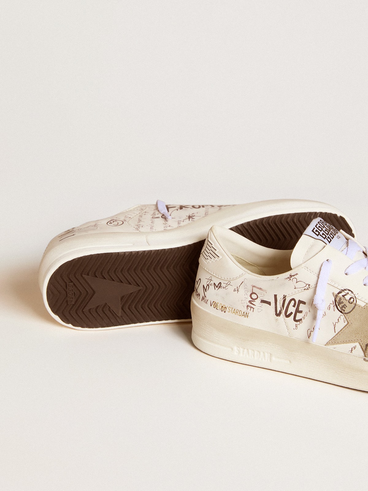 Stardan in leather with all-over lettering and ice-gray suede star