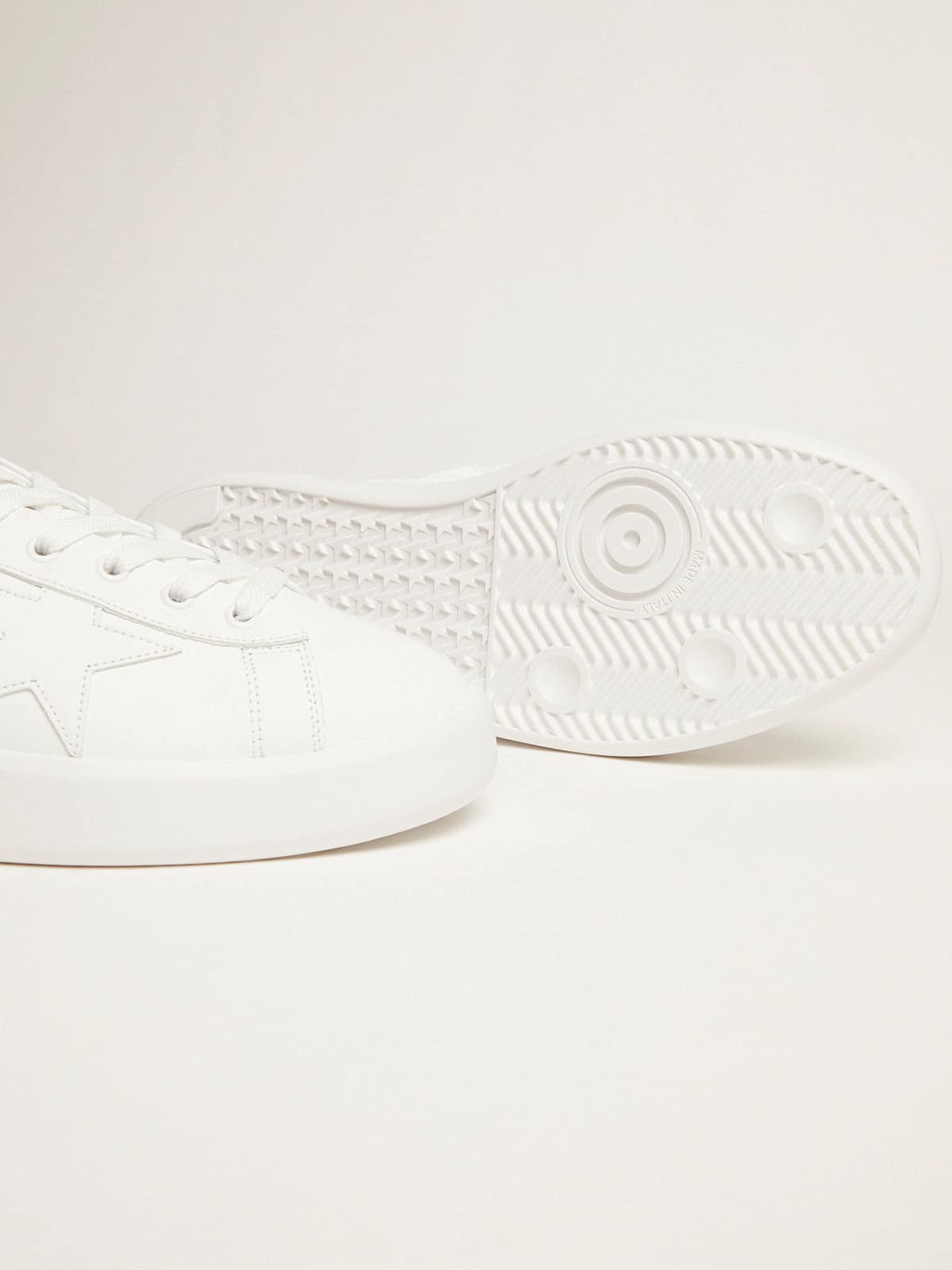White Purestar sneakers with fluorescent orange heel tab
