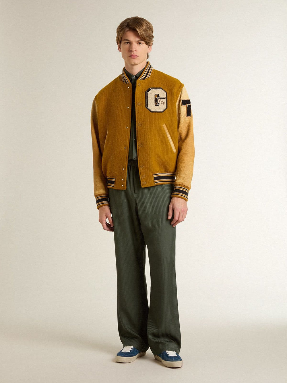 Ochre yellow wool bomber jacket with leather sleeves