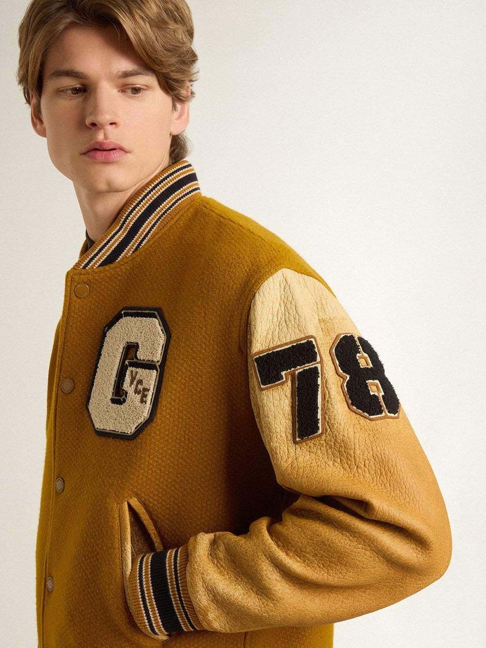 Ochre yellow wool bomber jacket with leather sleeves