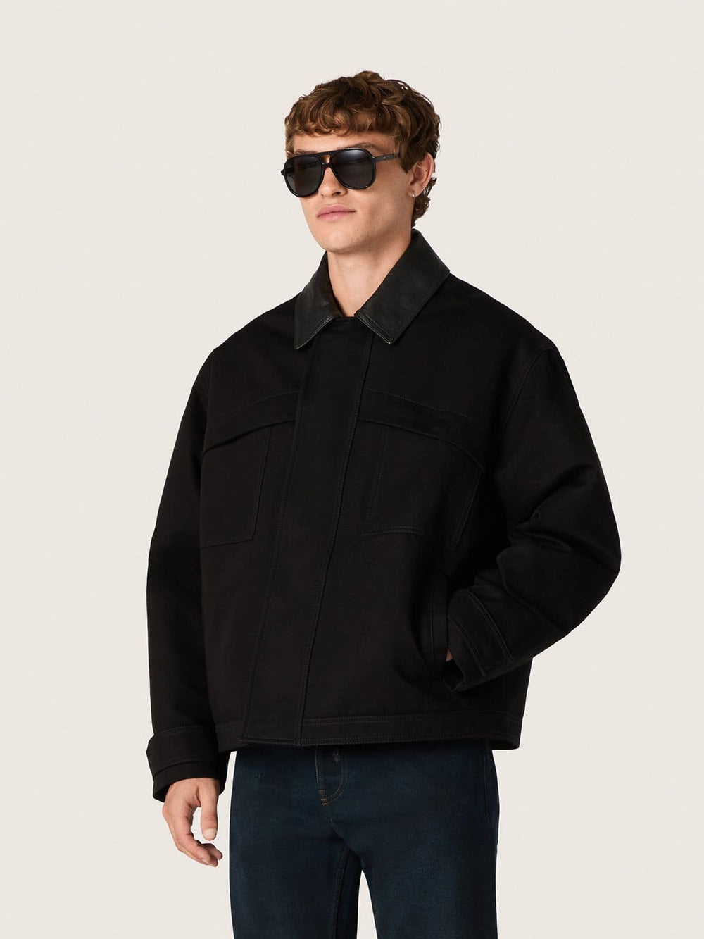 Men's short padded jacket in black cotton with leather collar