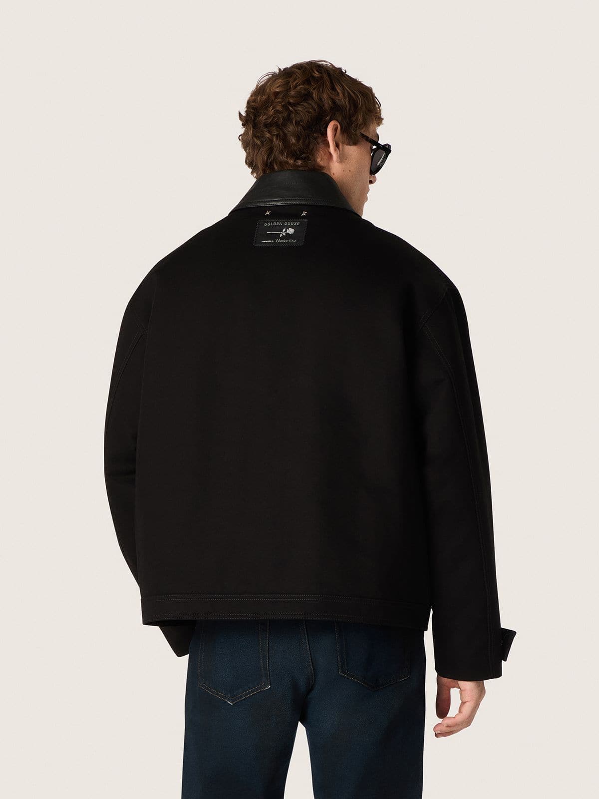 Men's short padded jacket in black cotton with leather collar