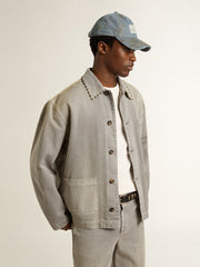Men's gray denim jacket with studs