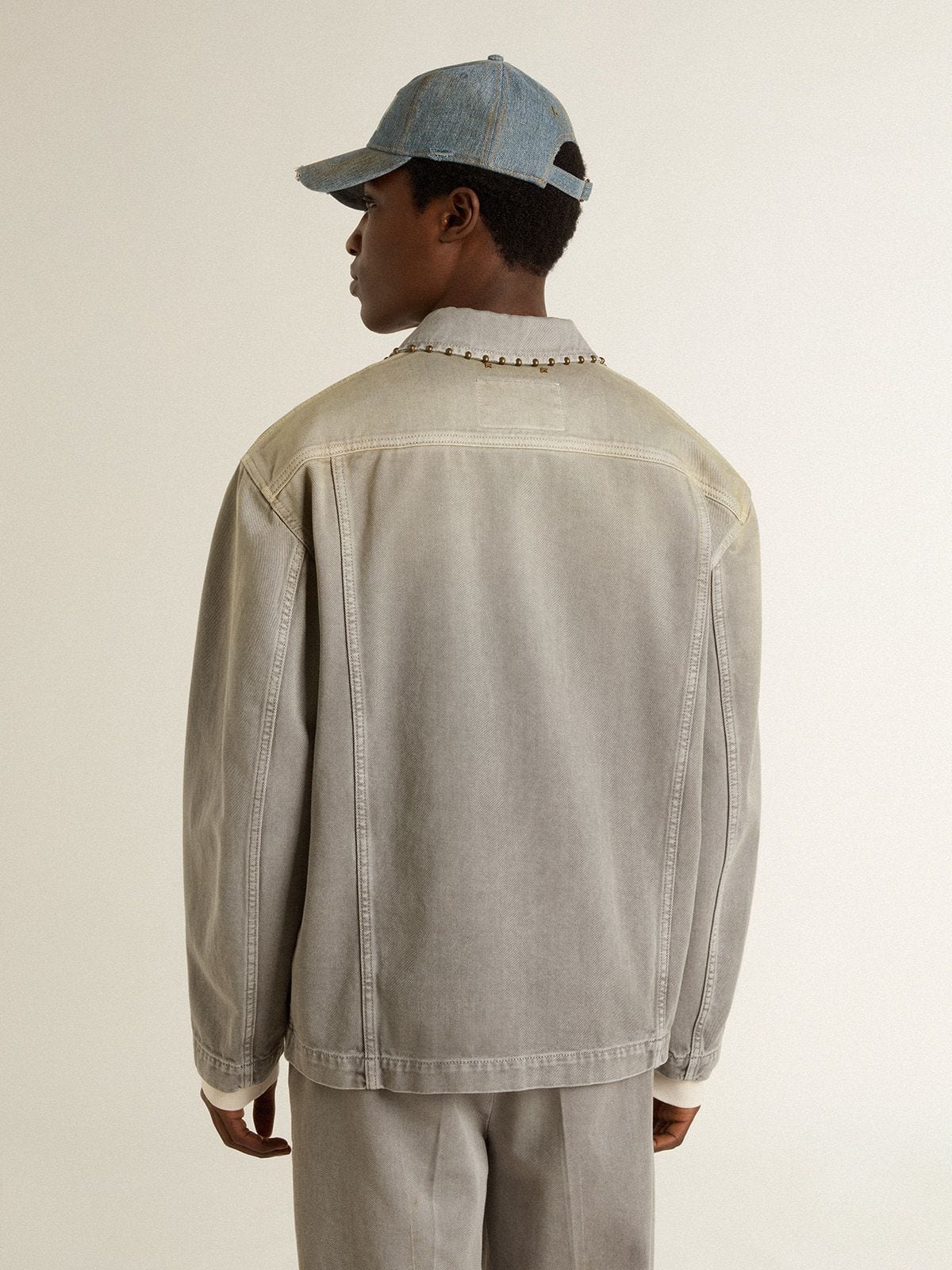 Men's gray denim jacket with studs