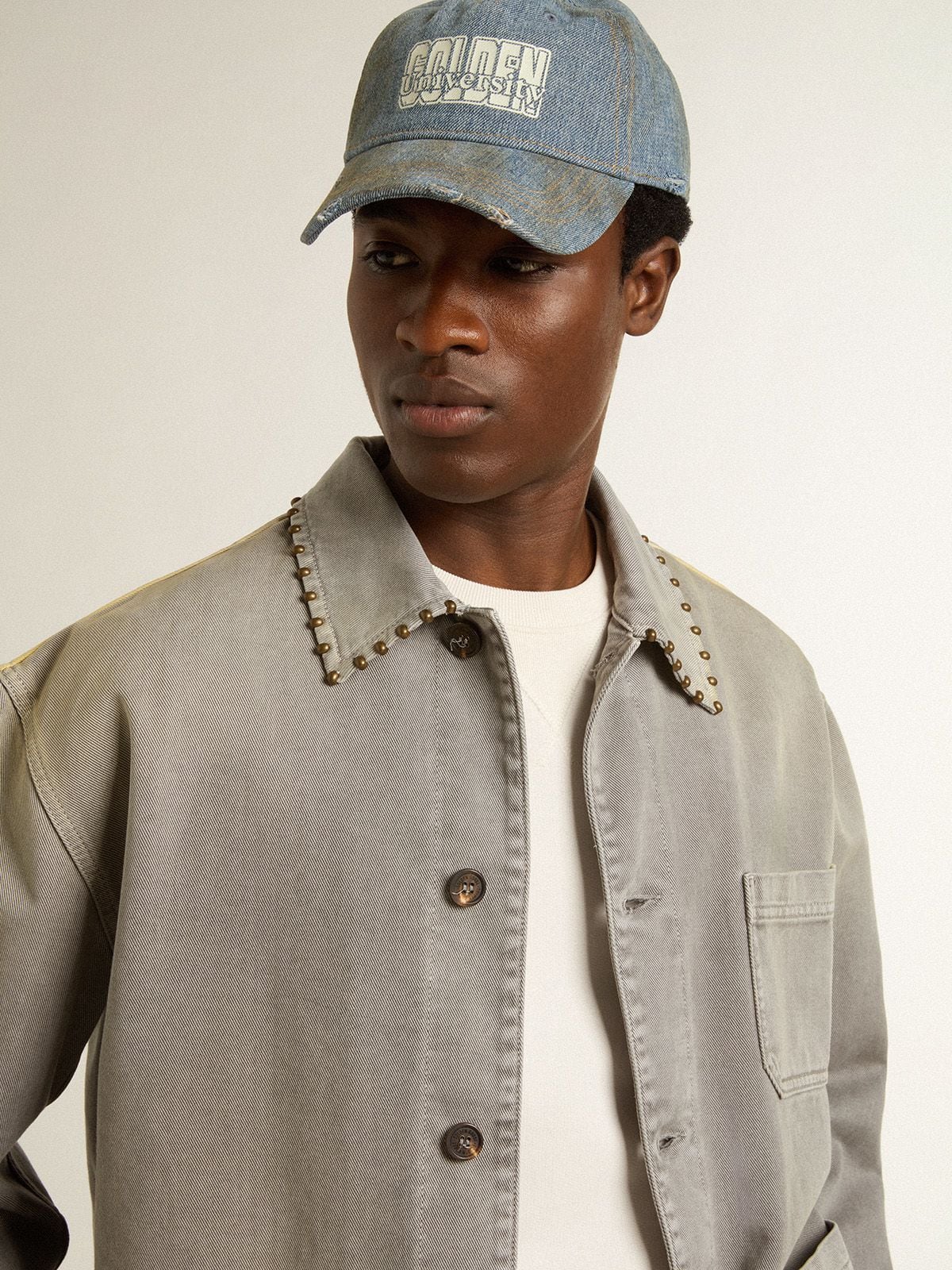 Men's gray denim jacket with studs