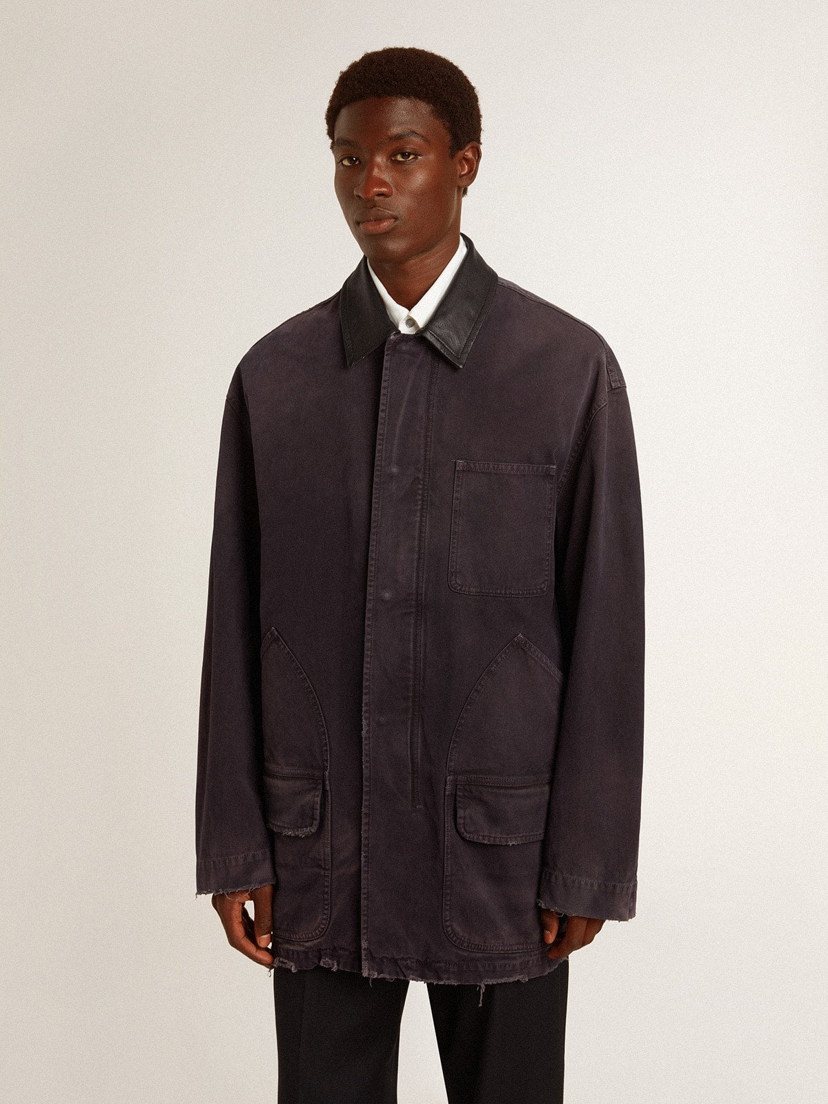 Men's denim jacket with distressed details and leather collar