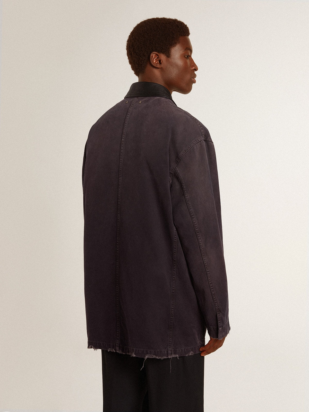 Men's denim jacket with distressed details and leather collar