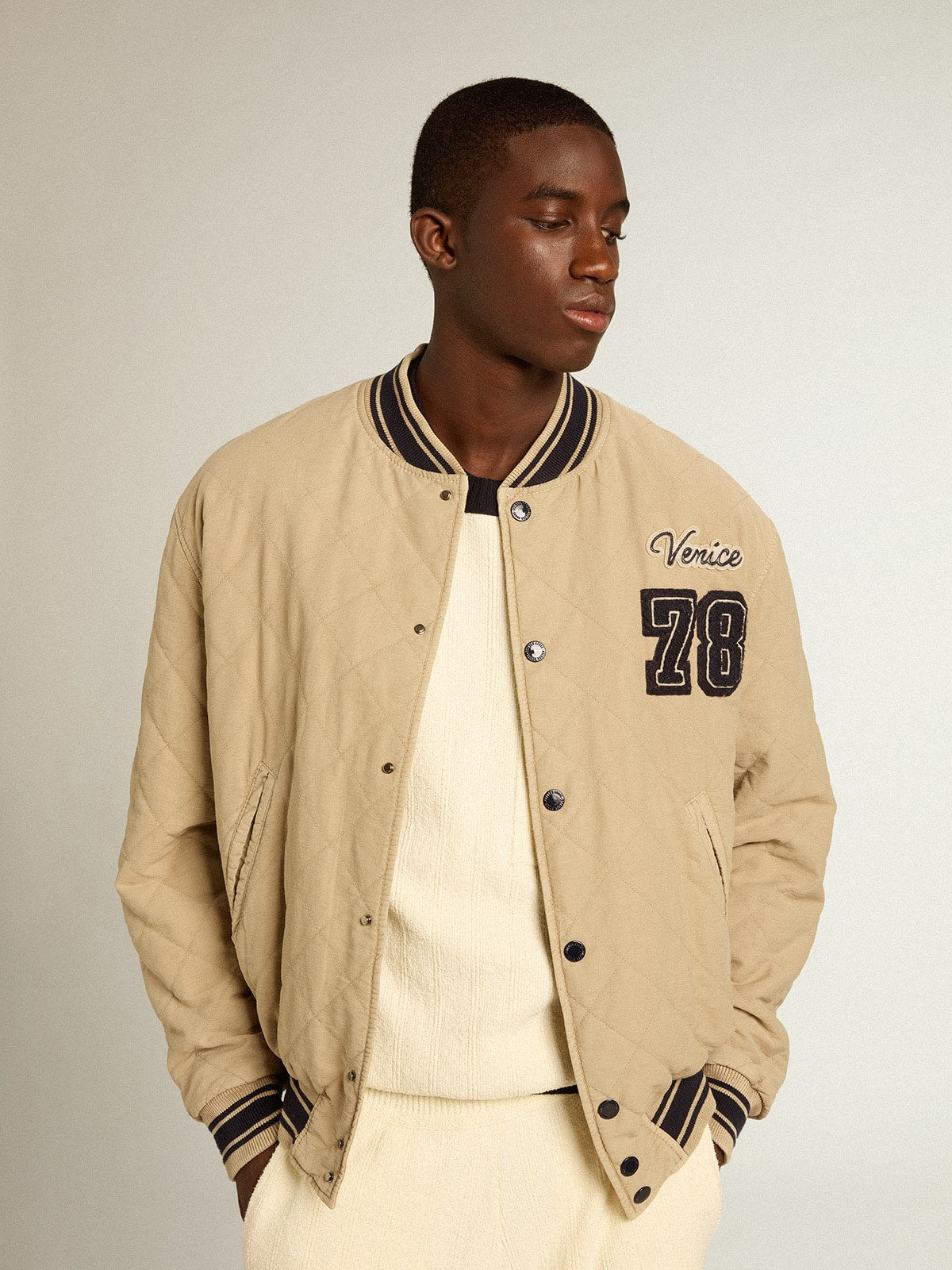 Khaki-colored quilted cotton bomber jacket