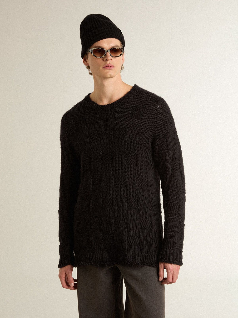 Men's black wool sweater with a distressed effect