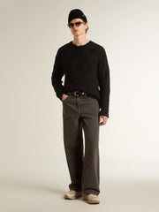 Men's black wool sweater with a distressed effect