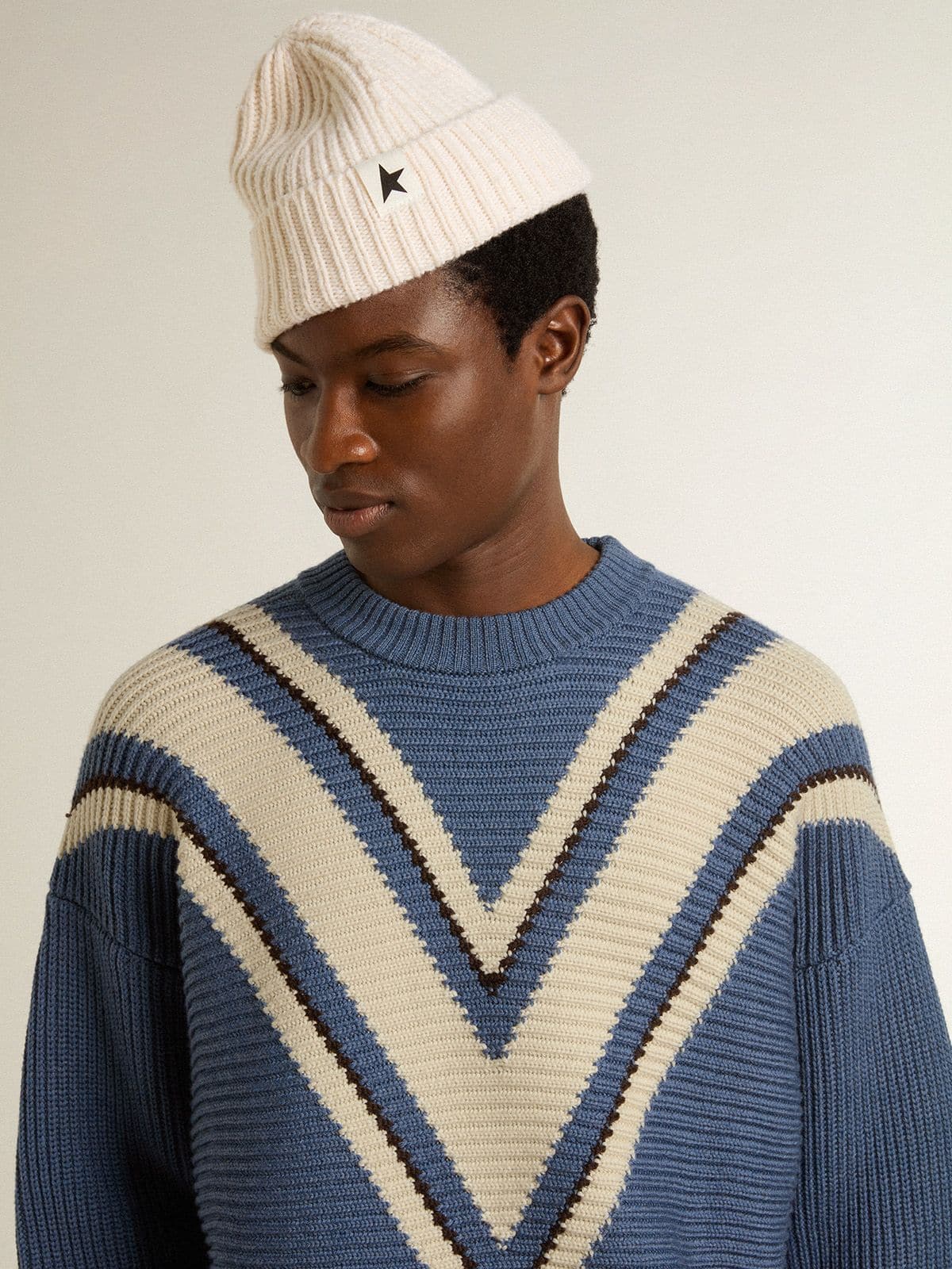 Men's light blue jacquard wool sweater with cream-colored pattern