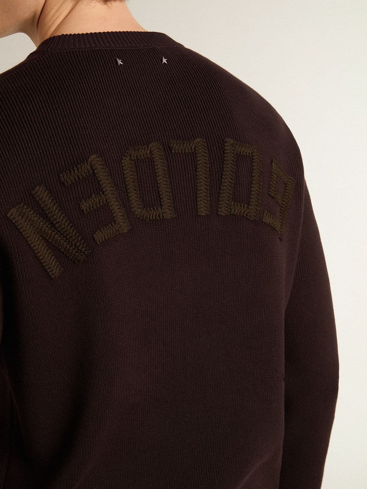 Men's brown crew-neck sweater with 'Golden' lettering on the back