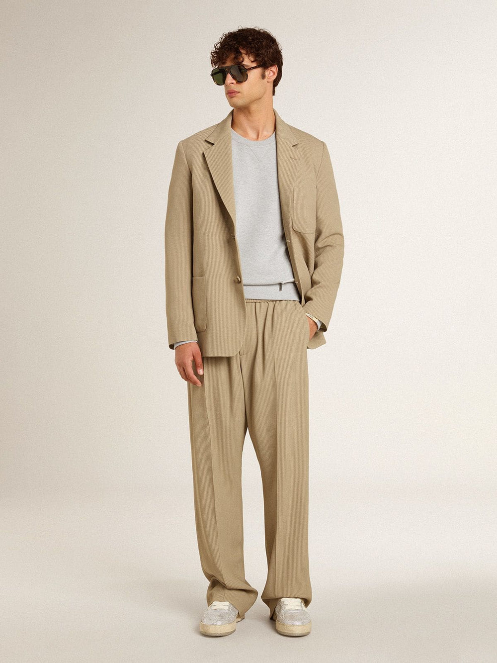 Men's beige pinstripe single-breasted jacket with an oversized fit