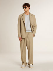 Men's beige pinstripe single-breasted jacket with an oversized fit