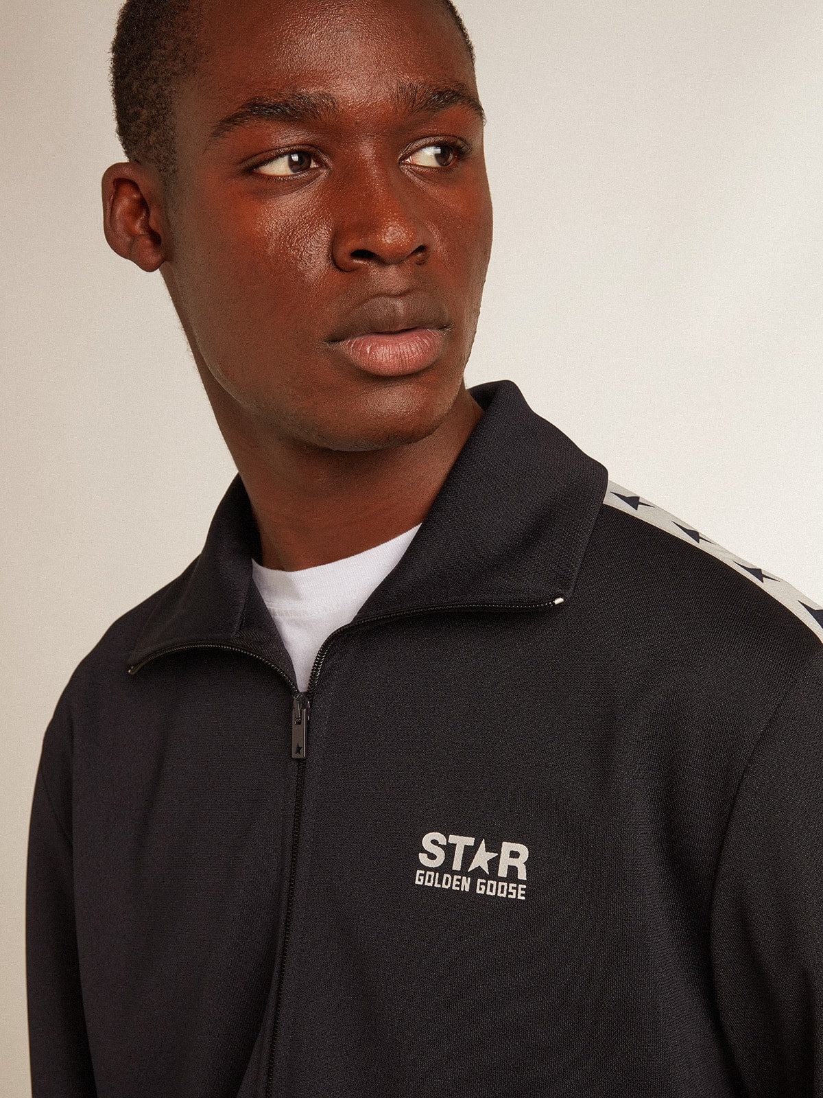 Dark blue sweatshirt with white strip and contrasting blue stars