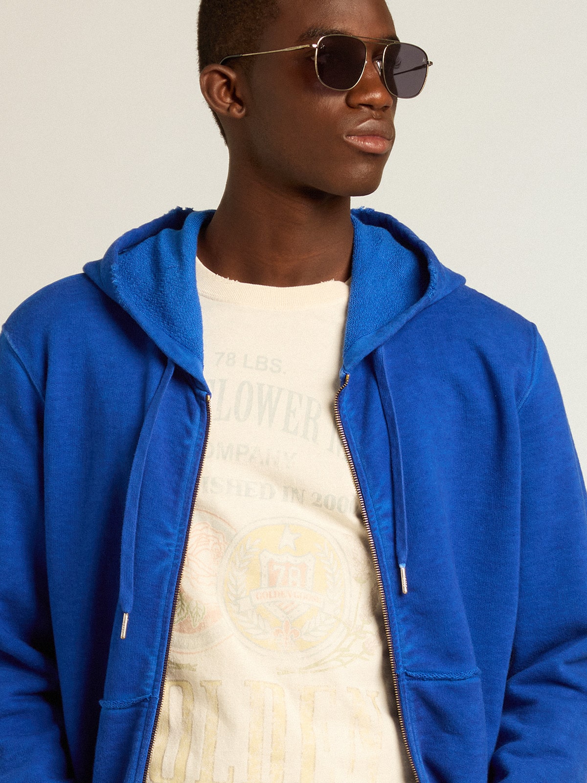 Men's blue-colored hoodie with lettering on the back
