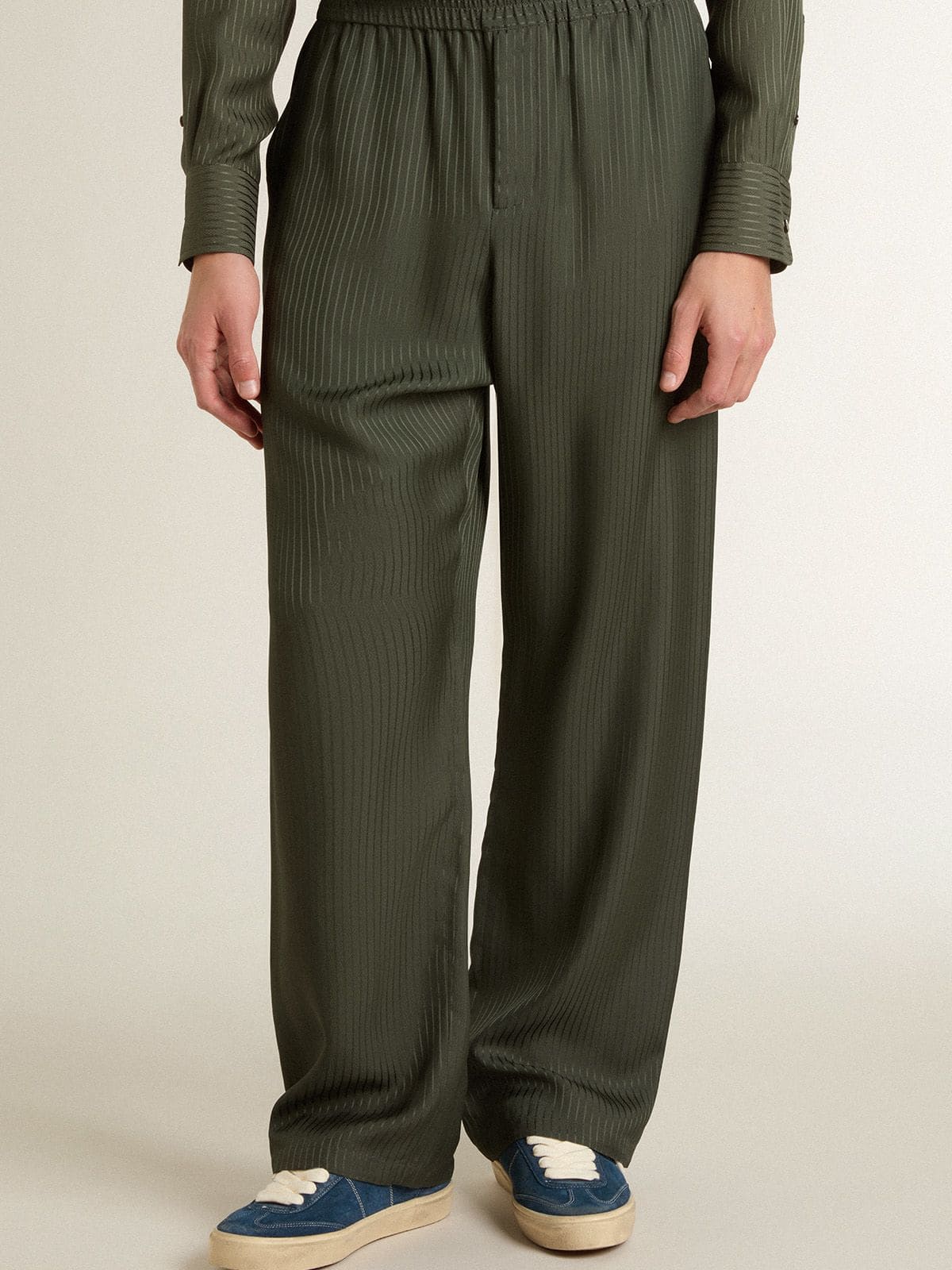 Men's dark green joggers with vertical stripes