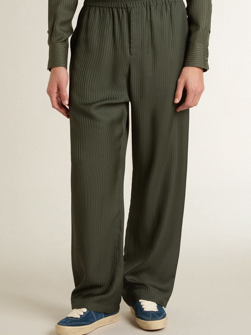 Men's dark green joggers with vertical stripes