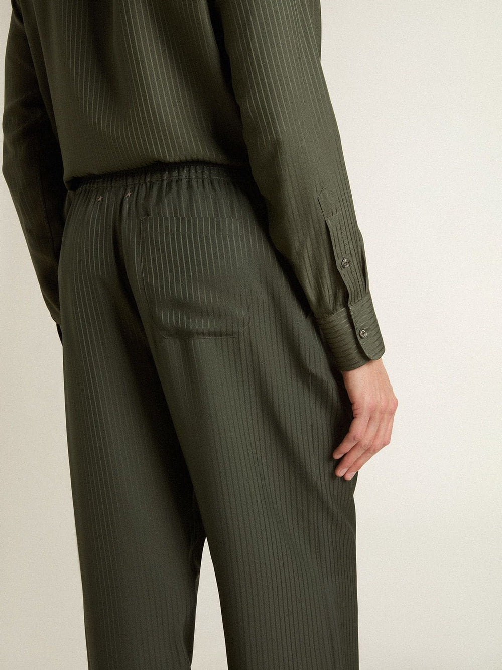 Men's dark green joggers with vertical stripes