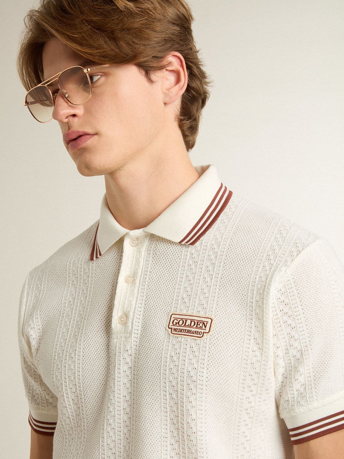 Men's polo shirt in white perforated knit with burgundy striped details